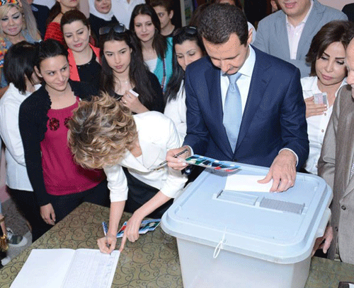 عکس: اسد و همسرش پای صندوق رأی